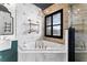 Beautiful bathroom with soaking tub, shower, window and industrial style shelving at 1291 Blackrush Dr, Tarpon Springs, FL 34689