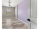 Inviting bedroom with wood-look flooring, neutral walls, and a ceiling fan at 1291 Blackrush Dr, Tarpon Springs, FL 34689