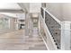 Spacious foyer with wood floors, elegant staircase, and open layout, showcasing the modern design at 1291 Blackrush Dr, Tarpon Springs, FL 34689