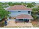 Aerial shot of the home exterior, featuring a large patio and spacious backyard at 1291 Blackrush Dr, Tarpon Springs, FL 34689
