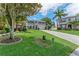Suburban two-story home with green lawn, two-car garage, and well-maintained landscaping at 1291 Blackrush Dr, Tarpon Springs, FL 34689