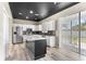 Modern kitchen featuring island with white countertop and stainless appliances at 1291 Blackrush Dr, Tarpon Springs, FL 34689