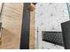 Shower with designer tile accents, rainfall shower head, and built in niche at 1291 Blackrush Dr, Tarpon Springs, FL 34689