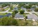 Aerial view of a residential neighborhood featuring lush greenery, well-kept houses, and manicured lawns at 13384 Brighton St, Spring Hill, FL 34609