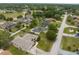 Residential aerial view showcasing tree-lined streets, well-maintained homes, and a community pool at 13384 Brighton St, Spring Hill, FL 34609