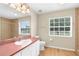 Bright bathroom with a large mirror, stylish vanity, tile flooring, and natural light from the window at 13384 Brighton St, Spring Hill, FL 34609