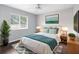 Staged bedroom showcases a comfortable bed, a bright window, and tasteful decor at 13384 Brighton St, Spring Hill, FL 34609