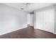 Bedroom with wood floors, closet and access to another room at 13384 Brighton St, Spring Hill, FL 34609