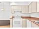 Neutral kitchen featuring white appliances and laminate countertops at 13384 Brighton St, Spring Hill, FL 34609