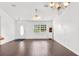 Bright living room featuring hardwood floors, large windows, and classic furnishings at 13384 Brighton St, Spring Hill, FL 34609