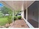 Covered patio with brick flooring provides an outdoor living space at 13384 Brighton St, Spring Hill, FL 34609