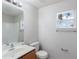 The bathroom with wood-look sink and large mirror at 14006 Amero Ln, Spring Hill, FL 34609
