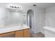 Bathroom with tile floor and arched doorway at 14006 Amero Ln, Spring Hill, FL 34609