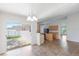 Eat-in-kitchen with sliding glass doors to screened porch, plus tile floors and island at 14006 Amero Ln, Spring Hill, FL 34609