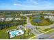 Aerial view showcasing the community's pools, lush landscapes, and surrounding areas at 1674 Roseville St, Lutz, FL 33549