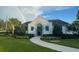 Willow Square clubhouse featuring a charming entrance with beautifully landscaped grounds at 1674 Roseville St, Lutz, FL 33549