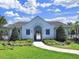 Community clubhouse boasts manicured lawn and inviting entrance, perfect for gatherings at 1674 Roseville St, Lutz, FL 33549