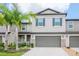 Charming two-story townhouse with a two-car garage and well manicured lawn at 1674 Roseville St, Lutz, FL 33549