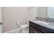 Elegant half bathroom features a granite countertop and modern fixtures at 1674 Roseville St, Lutz, FL 33549