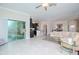 Spacious living room with sliding doors, that leads to the kitchen and dining room at 1674 Roseville St, Lutz, FL 33549
