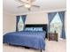 Inviting main bedroom featuring a large bed, soft carpeting, and natural light at 1674 Roseville St, Lutz, FL 33549
