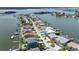 Scenic aerial view of neighborhood waterfront homes with boat docks along canal at 17025 Dolphin Dr, North Redington Beach, FL 33708