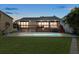 Backyard with a pool, wood deck, lawn and outdoor seating at 17025 Dolphin Dr, North Redington Beach, FL 33708