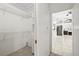 Walk in closet with shelving and storage, adjoining living areas at 17025 Dolphin Dr, North Redington Beach, FL 33708