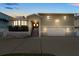 Two-story home with front yard, arched entryway, double front doors and two-car garage at 17025 Dolphin Dr, North Redington Beach, FL 33708