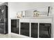 Kitchen counter featuring cabinetry, backsplash and stainless steel appliances at 17025 Dolphin Dr, North Redington Beach, FL 33708