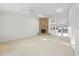Large living room featuring stone fireplace, white walls and ceiling fans at 17025 Dolphin Dr, North Redington Beach, FL 33708