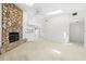 Open living room featuring stone fireplace and carpet at 17025 Dolphin Dr, North Redington Beach, FL 33708