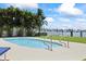 The home features a private pool with lush tropical landscaping and tranquil water views at 17025 Dolphin Dr, North Redington Beach, FL 33708