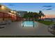 Backyard with a private pool, lush landscaping, deck and waterfront views at 17025 Dolphin Dr, North Redington Beach, FL 33708