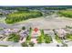 Aerial view of house near a lake and woods showing the beautiful surroundings at 1830 Cameron Ct, Trinity, FL 34655