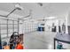 Spacious two car garage with bright lighting and epoxy floor coating at 1830 Cameron Ct, Trinity, FL 34655