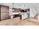 Open-concept kitchen featuring a large island, stainless steel appliances, and plenty of cabinet space at 1830 Cameron Ct, Trinity, FL 34655