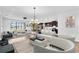 Spacious living room with modern furniture, hardwood floors, and an open floor plan at 1830 Cameron Ct, Trinity, FL 34655