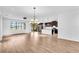 Spacious living room with hardwood floors, large windows, and an open floor plan at 1830 Cameron Ct, Trinity, FL 34655