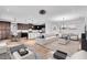 Open living space combines kitchen, dining, and living areas with modern decor and lots of space to move around at 1830 Cameron Ct, Trinity, FL 34655