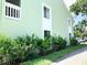 Exterior side view of the condo with nice green bushes at 1865 Mazo Manor # 1, Lutz, FL 33558