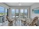 Relaxing balcony with chairs and a small table overlooking scenic water views at 19029 Us Highway 19 N # 8-31, Clearwater, FL 33764