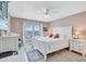 Comfortable bedroom with a large bed, a window view and white dressers provides a peaceful retreat at 19029 Us Highway 19 N # 8-31, Clearwater, FL 33764