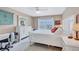 Comfortable bedroom with a large bed, a window view and white dressers provides a peaceful retreat at 19029 Us Highway 19 N # 8-31, Clearwater, FL 33764