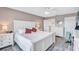 Comfortable bedroom with a large bed, a window view and white dressers provides a peaceful retreat at 19029 Us Highway 19 N # 8-31, Clearwater, FL 33764
