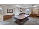 Enjoy a game of billiards in this dedicated room featuring a pool table and cues at 19029 Us Highway 19 N # 8-31, Clearwater, FL 33764