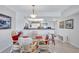 Inviting dining area with a glass table and seating, open to the modern kitchen at 19029 Us Highway 19 N # 8-31, Clearwater, FL 33764