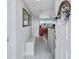Inviting condo entryway with neutral colors, a bench, and glimpses of a bright living space at 19029 Us Highway 19 N # 8-31, Clearwater, FL 33764