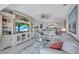 Spacious living area featuring open concept with kitchen view and comfortable furnishings at 19029 Us Highway 19 N # 8-31, Clearwater, FL 33764