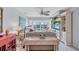 Well-lit living room featuring stylish decor, access to a balcony and a ceiling fan at 19029 Us Highway 19 N # 8-31, Clearwater, FL 33764